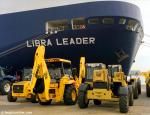 ID 2496 LIBRA LEADER (1998/57674grt/IMO 9174490) - earthmoving equipment in the cargo consolidation compound ready for loading aboard during the ship's maiden call at Southampton, England.